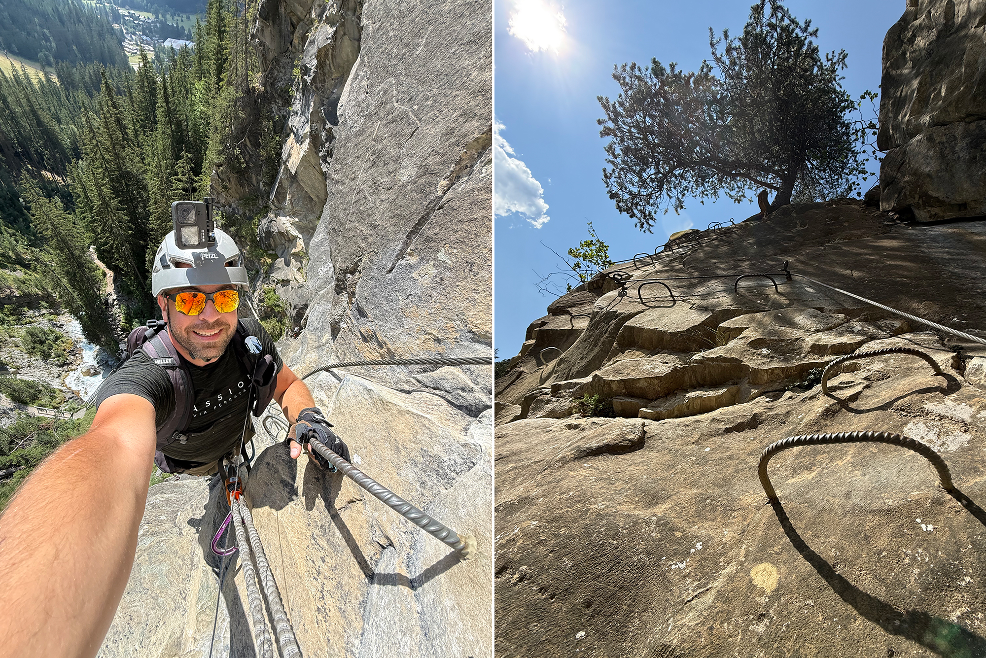 Climber wearing helmet and harness, taking a selfie on a steep rock face with a rope and forested valley in the background.