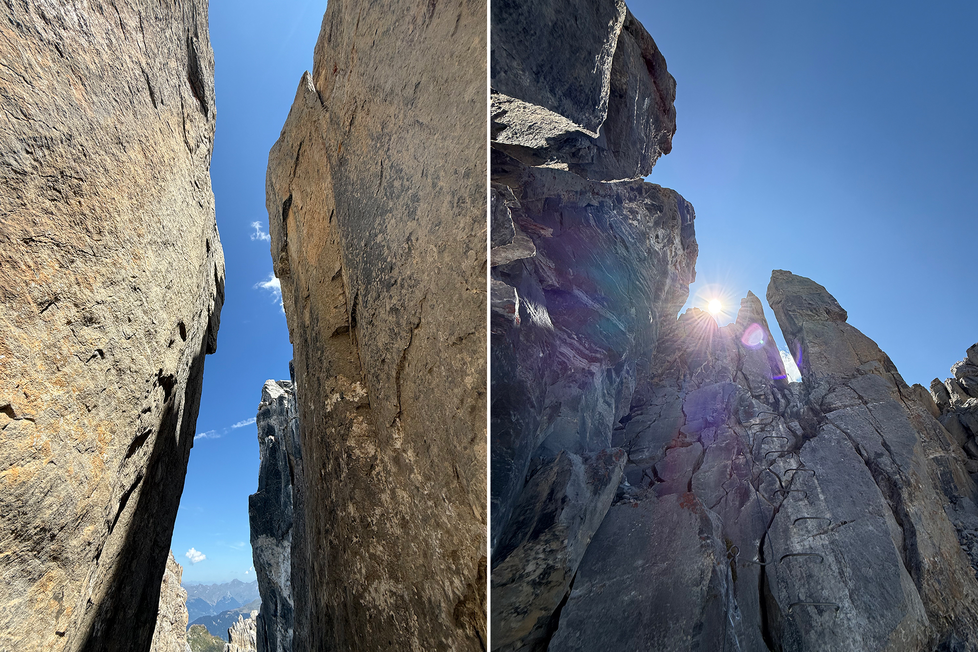 Two towering rock walls form a narrow canyon under a clear blue sky with distant mountains visible between them.