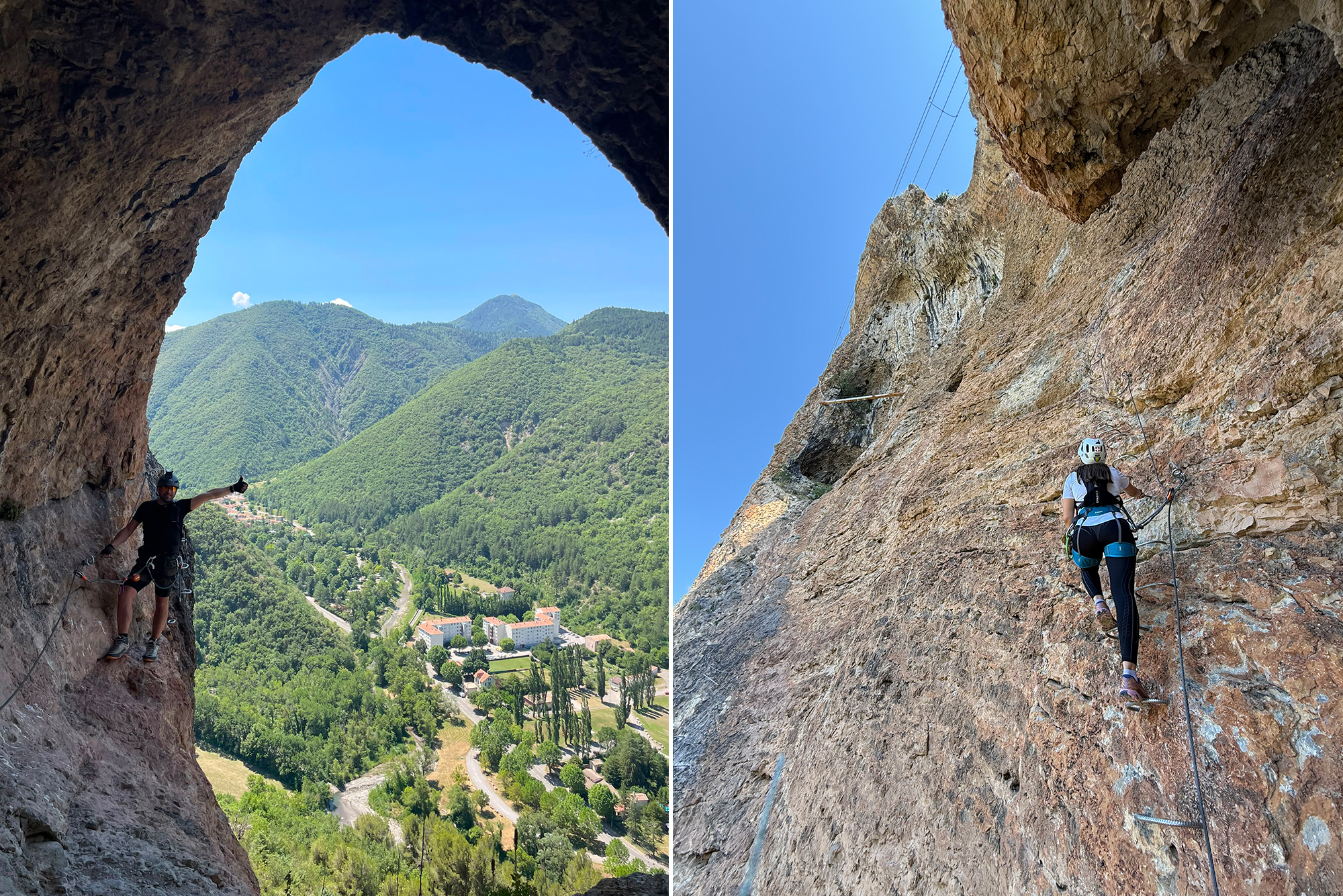 Climber in helmet and harness ascending a vertical rock face, with a valley, roads and forested mountains below under a blue sky.
